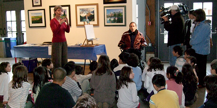 Mouth painter Cody Tresierra at a City event on International Day of Persons with Disabilities