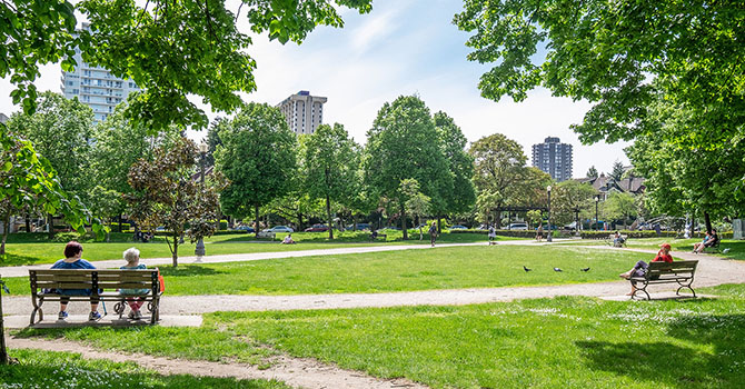 People sitting on benches in Nelson Park