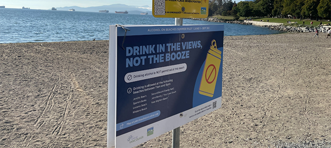 A sign that says drinking is prohibited on Vancouver beaches 