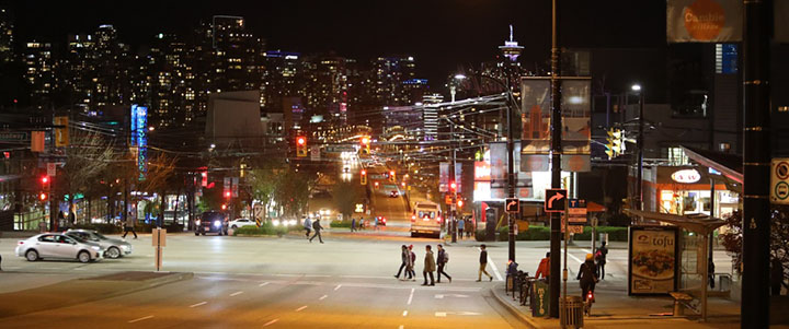 Intersection lit by street lights at night