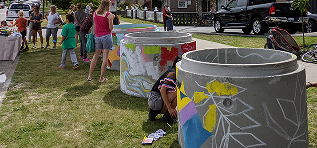 People painting on sewer lines People painting on sewer lines