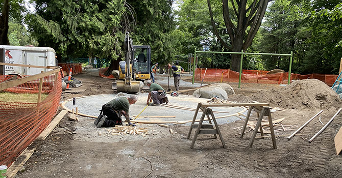 People replacing a playground at a park People replacing a playground at a park