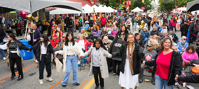 People celebrating National Indigenous Peoples Day at a block party