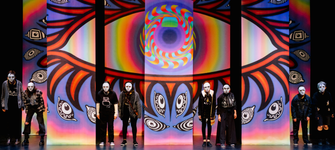Performers on a stage in masks Performers on a stage in masks