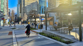 A person bikes through the permanent Bute and Robson Plaza