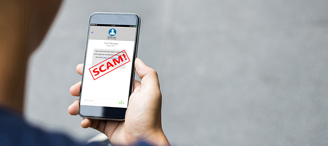 A person holds a phone up with an alert that says 