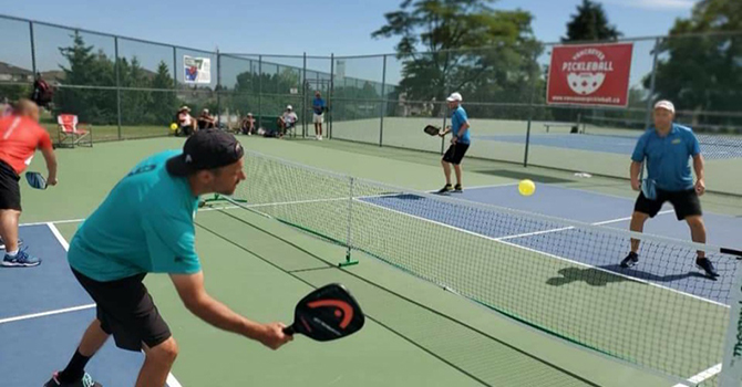 People playing pickleball on a pickleball court