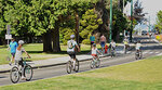 People cycling on the protected bike lane near Point Grey Road at Macdonald Street People cycling on the protected bike lane near Point Grey Road at Macdonald Street