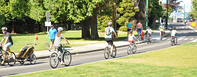 People riding bikes down the Point Grey protected bike lane People riding bikes down the Point Grey protected bike lane