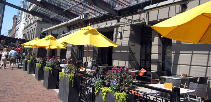 Tables, chairs, and patio umbrellas on a restaurant patio