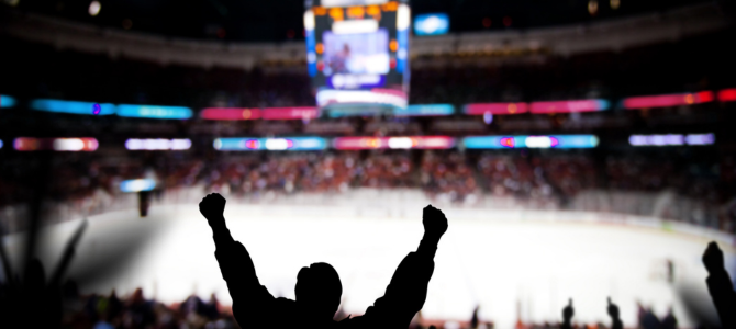 A fan cheers at a hockey game at Roger's Arena 