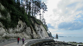 People walking on the seawall near Siwash Rock