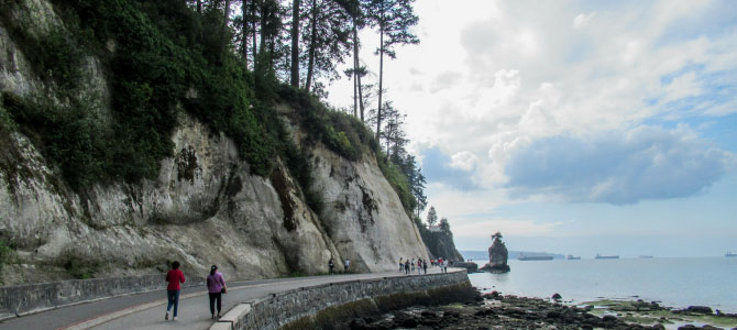 People walking on the seawall near Siwash Rock