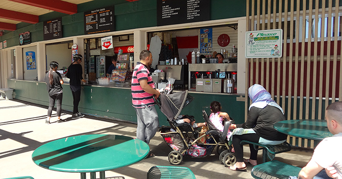 Second Beach concession stand with customers ordering at the counter