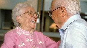 Two seniors dancing together