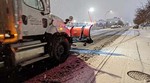 City of Vancouver snow plow truck on a street covered in snow. 