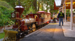 People standing next to the Stanley Park Train