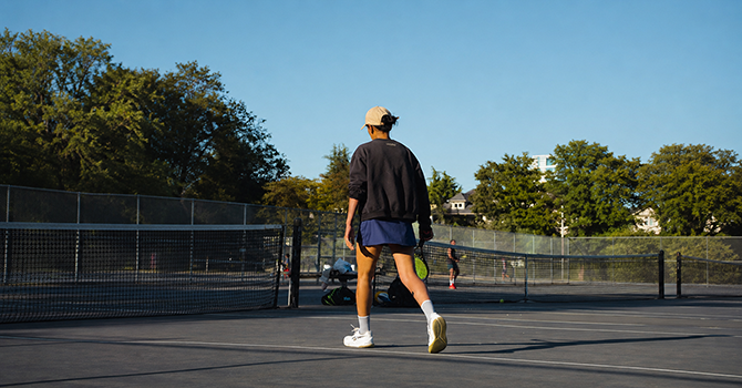 Tennis player walking on the courts at Kitsilano Beach. 