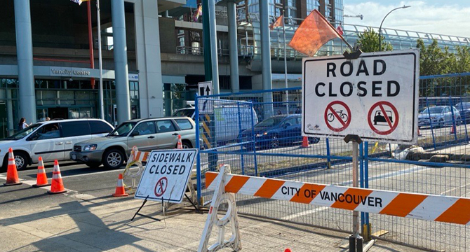 Road closure sign blocking off part of a street