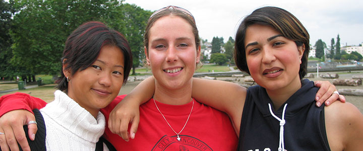 Three woman posing for picture