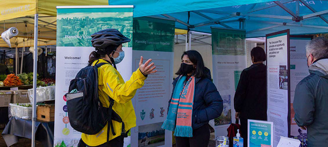 People attending a Vancouver Plan engagement event at a farmer's market