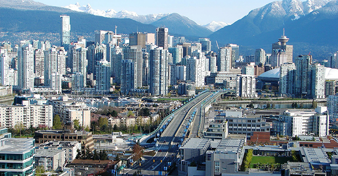 Vancouver skyline with the Cambie Bridge and North Shore mountains in the background