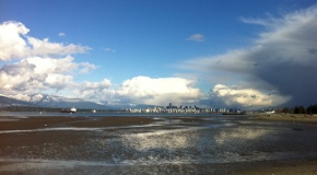 Clouds and sunny skies over Vancouver and Burrard Inlet, looking from Spanish Banks