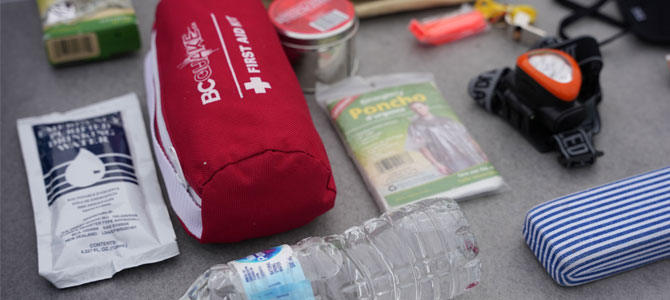 VEMA supplies: water bottle, poncho, first aid kit, water