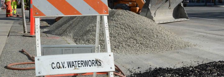 City Waterworks sign on sidewalk