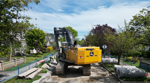 Excavator working on a sewer separation at West 49th