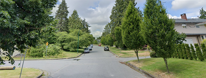 Tree-lined West 54th Avenue in a residential neighbourhood