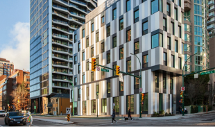 Street view of 825 Pacific with pedestrians crossing the street in front of the buliding