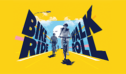 Bike Walk Roll text with people riding bikes on the road