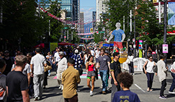 People walking on Granville Street during a festival