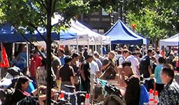 A crowded outdoor market on a sunny day