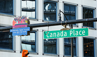 Guru Nanak Jahaz (Komagata Maru) Place sign affixed next to to the Canada Place street sign.