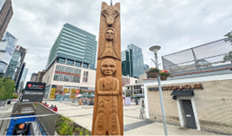 House post titled “Syewá:l” (Ancestors) by Zachary George Sko-Kay-Lem, installed in the plaza outside the Queen Elizabeth Theatre.