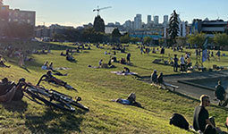 People sitting on the grass at Jonathan Rogers Park