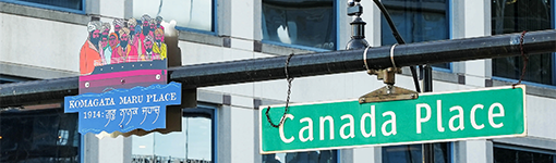 Komagata Maru Place sign affixed next to to the Canada Place street sign. 