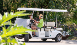 People in a golf cart at VanDusen