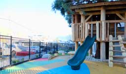 Slide and playground with a rubber floor at RayCam Community Centre