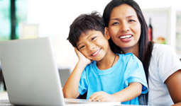 Woman and child at computer