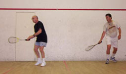 Two people playing squash