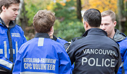 Vancouver police officer with community policing volunteers