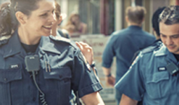 Two police officers smiling