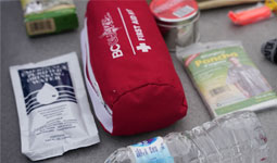 VEMA supplies: water bottle, poncho, first aid kit, water