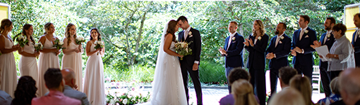 Wedding couple kissing in ceremony at the Celebration Pavilion