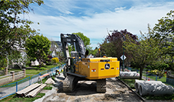 Excavator working on a sewer separation at West 49th