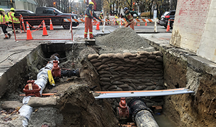 Exposed underground water pipes for the West Pender Street water upgrade project.